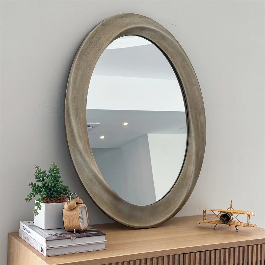 Miroir ovale baroque doré