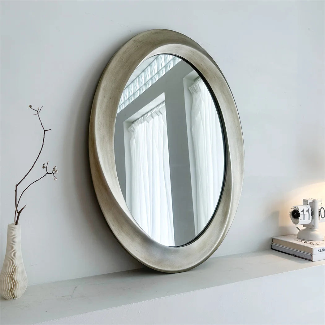 Miroir ovale baroque doré